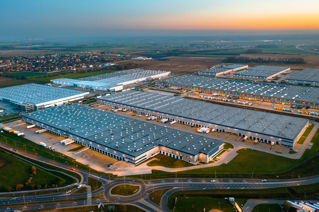 Aerial view of a logistics park at sunset